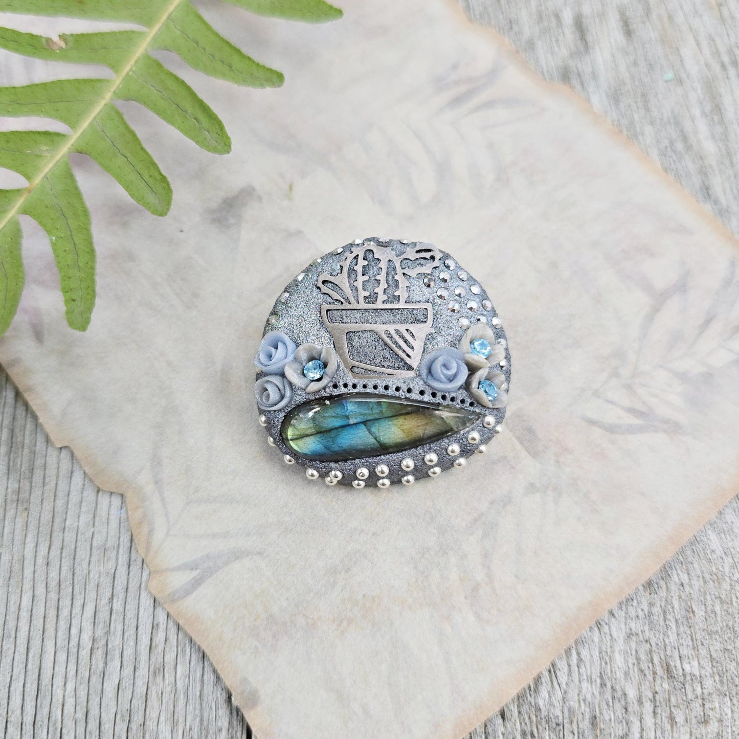 Handmade cactus brooch with shimmering labradorite, crafted from polymer clay and stainless steel – a unique mystical accessory inspired by nature.