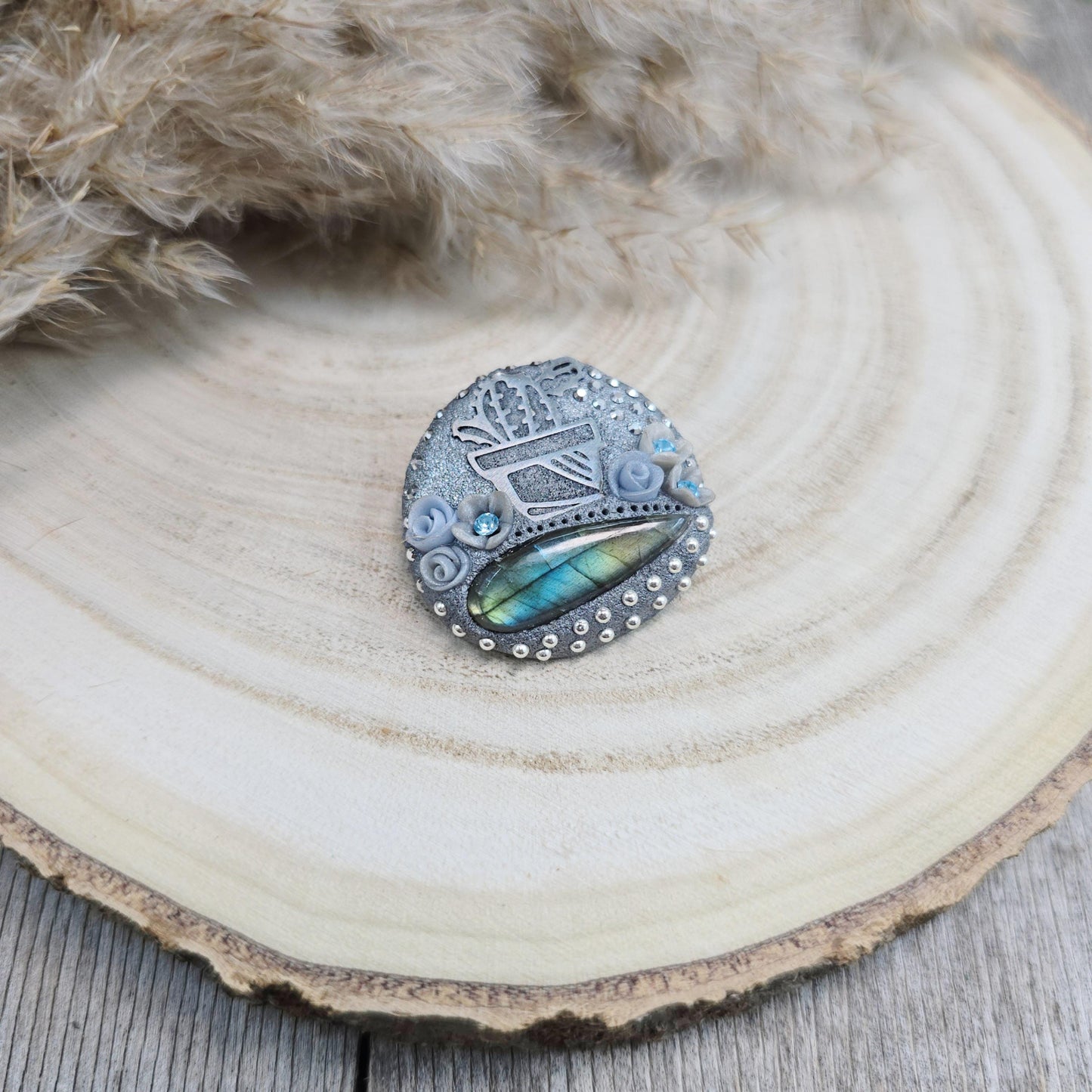 Handmade cactus brooch with shimmering labradorite, crafted from polymer clay and stainless steel – a unique mystical accessory inspired by nature.