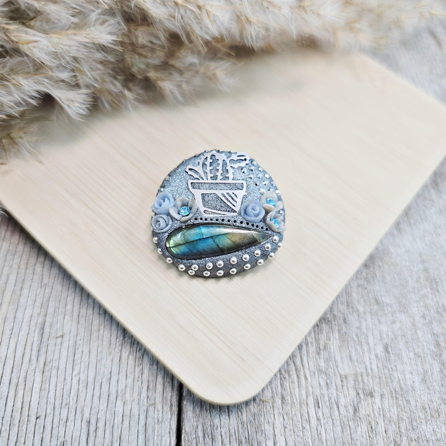 Handmade cactus brooch with shimmering labradorite, crafted from polymer clay and stainless steel – a unique mystical accessory inspired by nature.