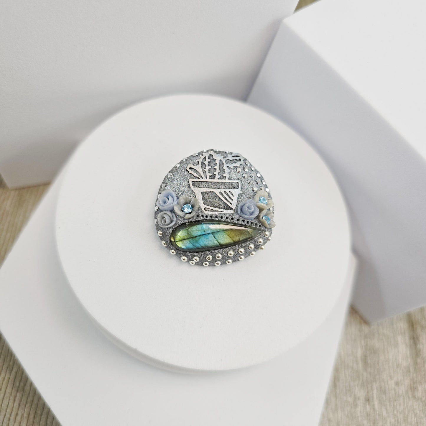Handmade cactus brooch with shimmering labradorite, crafted from polymer clay and stainless steel – a unique mystical accessory inspired by nature.