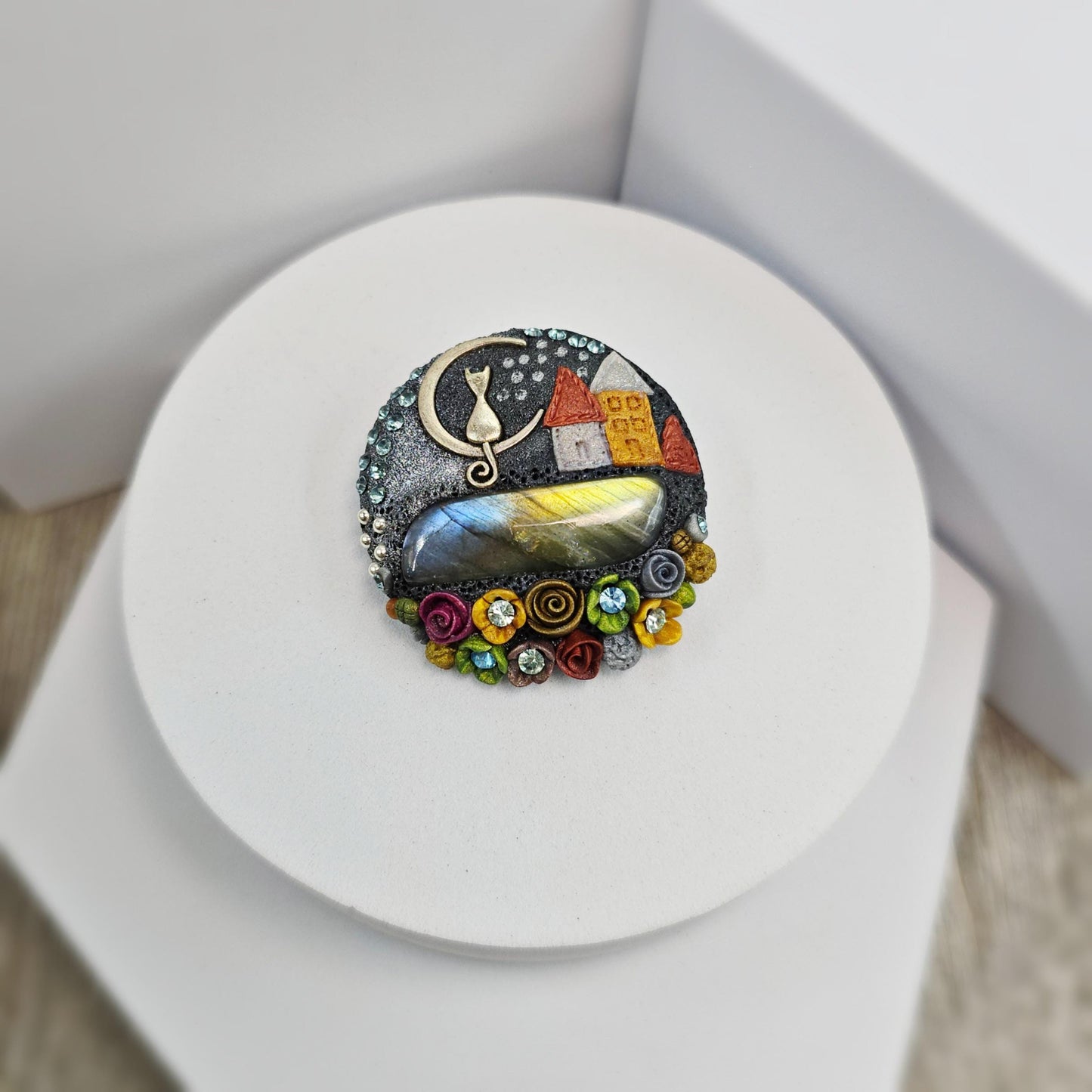 Handmade polymer clay brooch with labradorite and metal cat – magical, nature-inspired accessory for cat lovers.