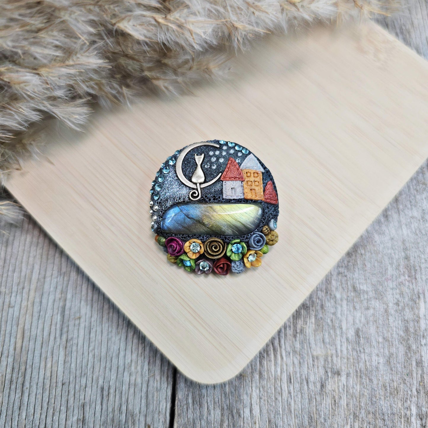 Handmade polymer clay brooch with labradorite and metal cat – magical, nature-inspired accessory for cat lovers.