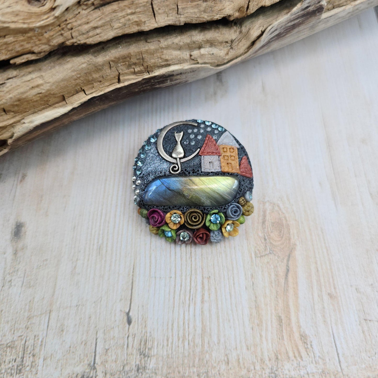 Handmade polymer clay brooch with labradorite and metal cat – magical, nature-inspired accessory for cat lovers.