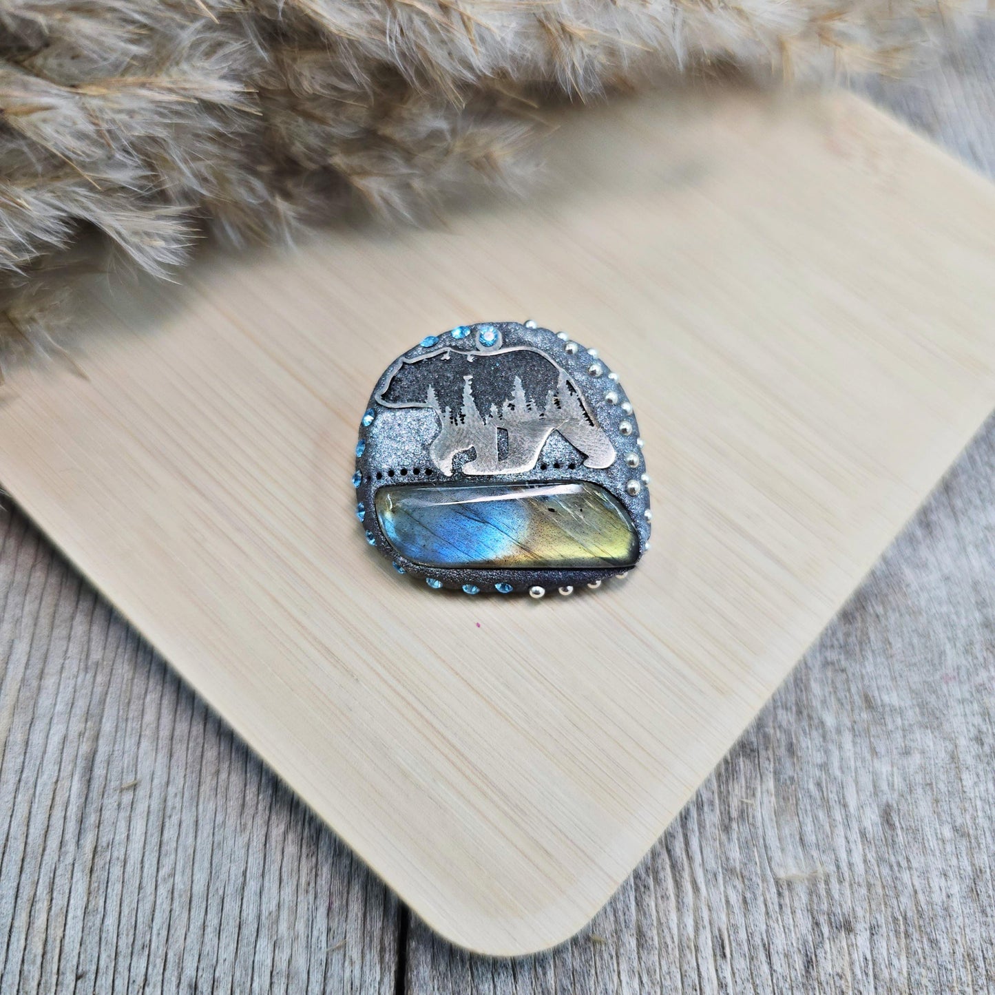 Handmade brooch with labradorite and bear design – polymer clay pin symbolizing strength and protection, unique nature-inspired jewelry.