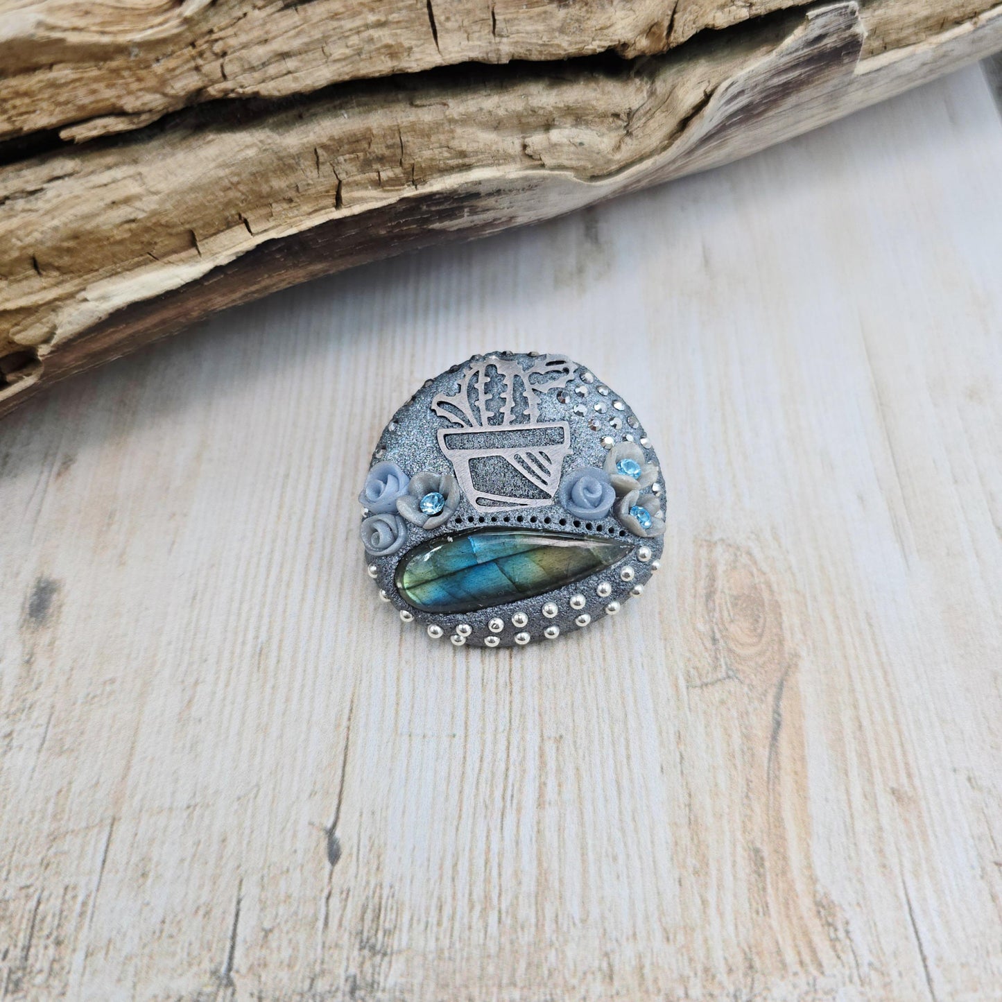 Handmade cactus brooch with shimmering labradorite, crafted from polymer clay and stainless steel – a unique mystical accessory inspired by nature.