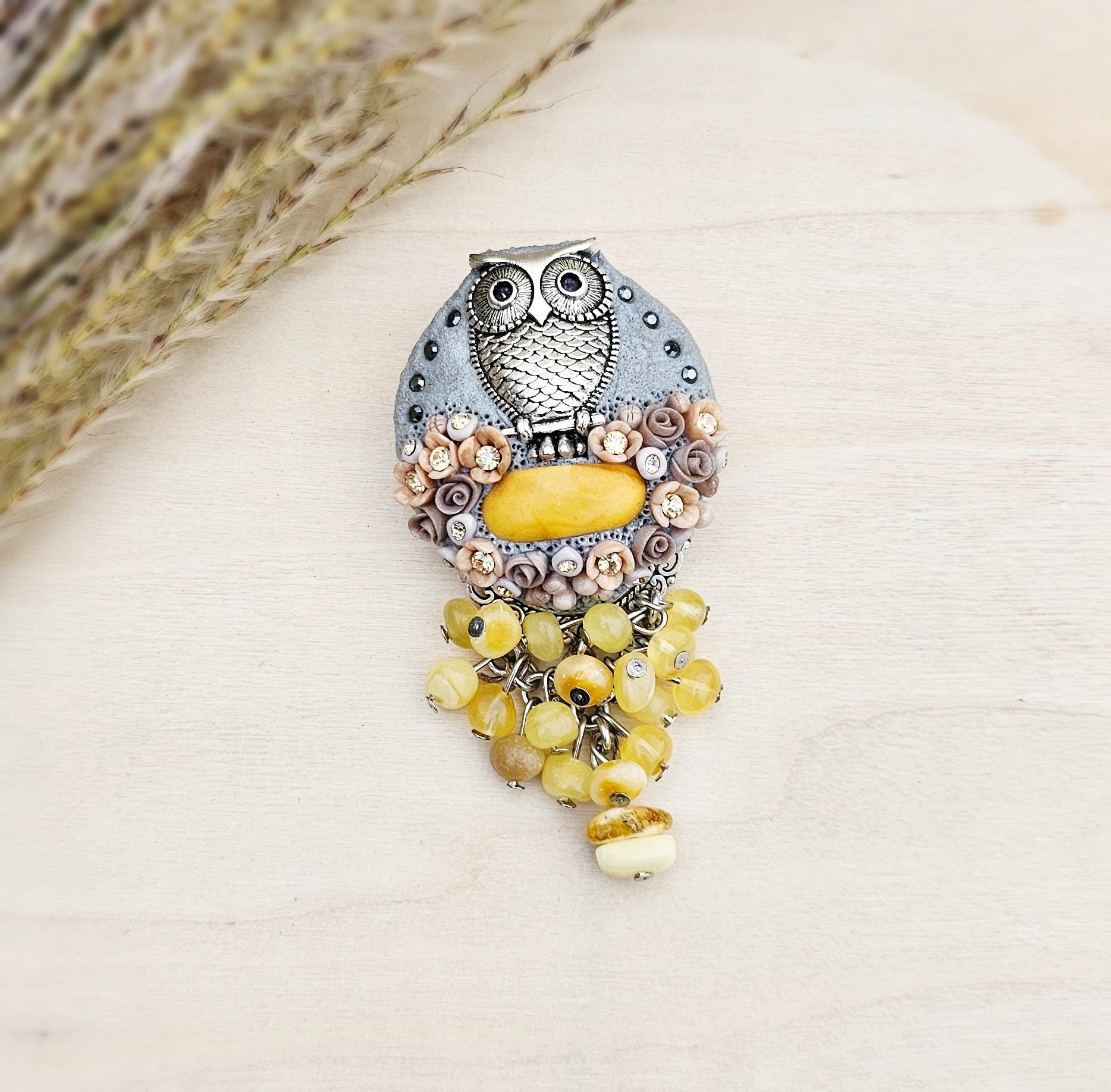 handmade polymer clay brooch with owl and handmade flowers and baltic amber
