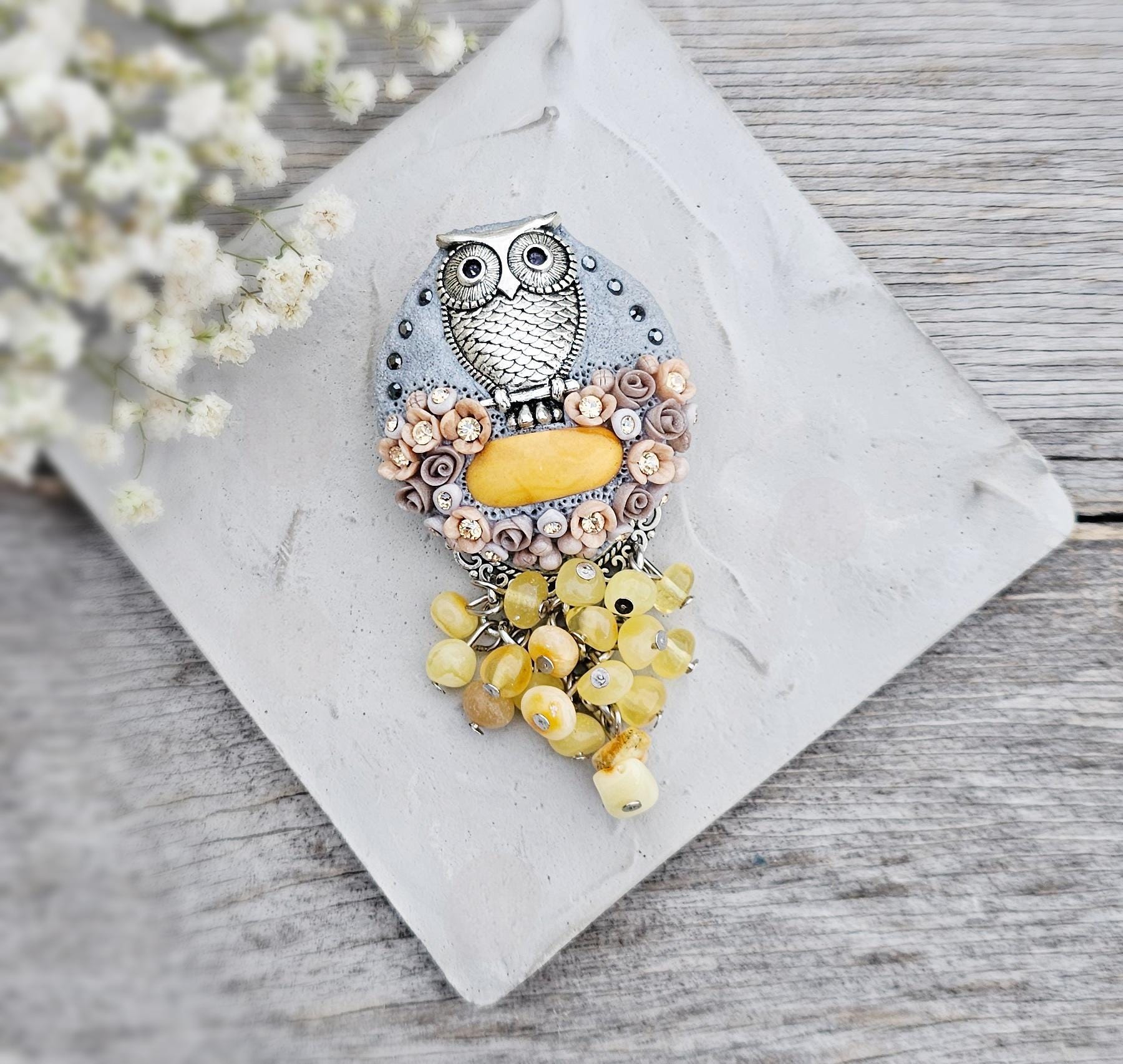 handmade polymer clay brooch with owl and handmade flowers and baltic amber