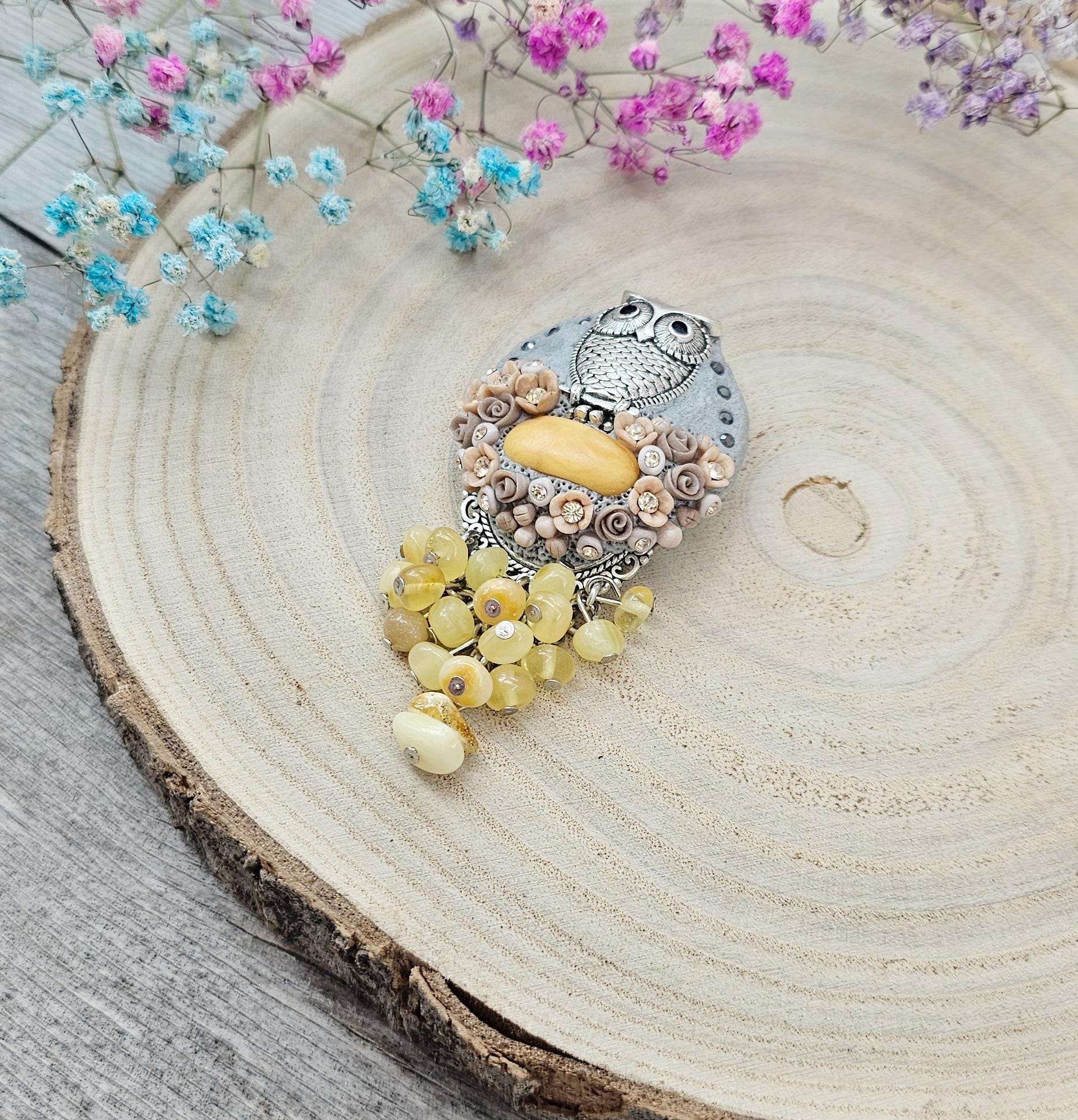 handmade polymer clay brooch with owl and handmade flowers and baltic amber