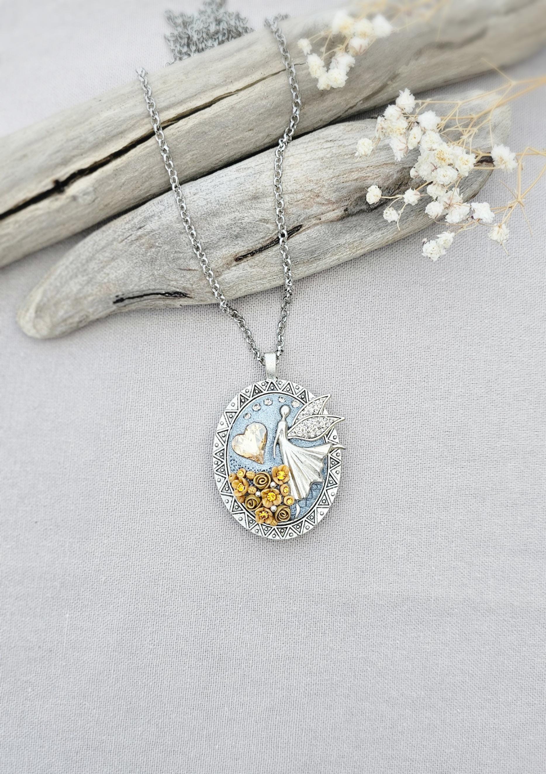 soft gold pendant, fairy locket, floral jewelry, crystal heart necklace, handcrafted pendant, whimsical charm, fairy tale jewelry, unique locket, keepsake necklace, elegant accessory, photo locket, artisan necklace, silver chain pendant
