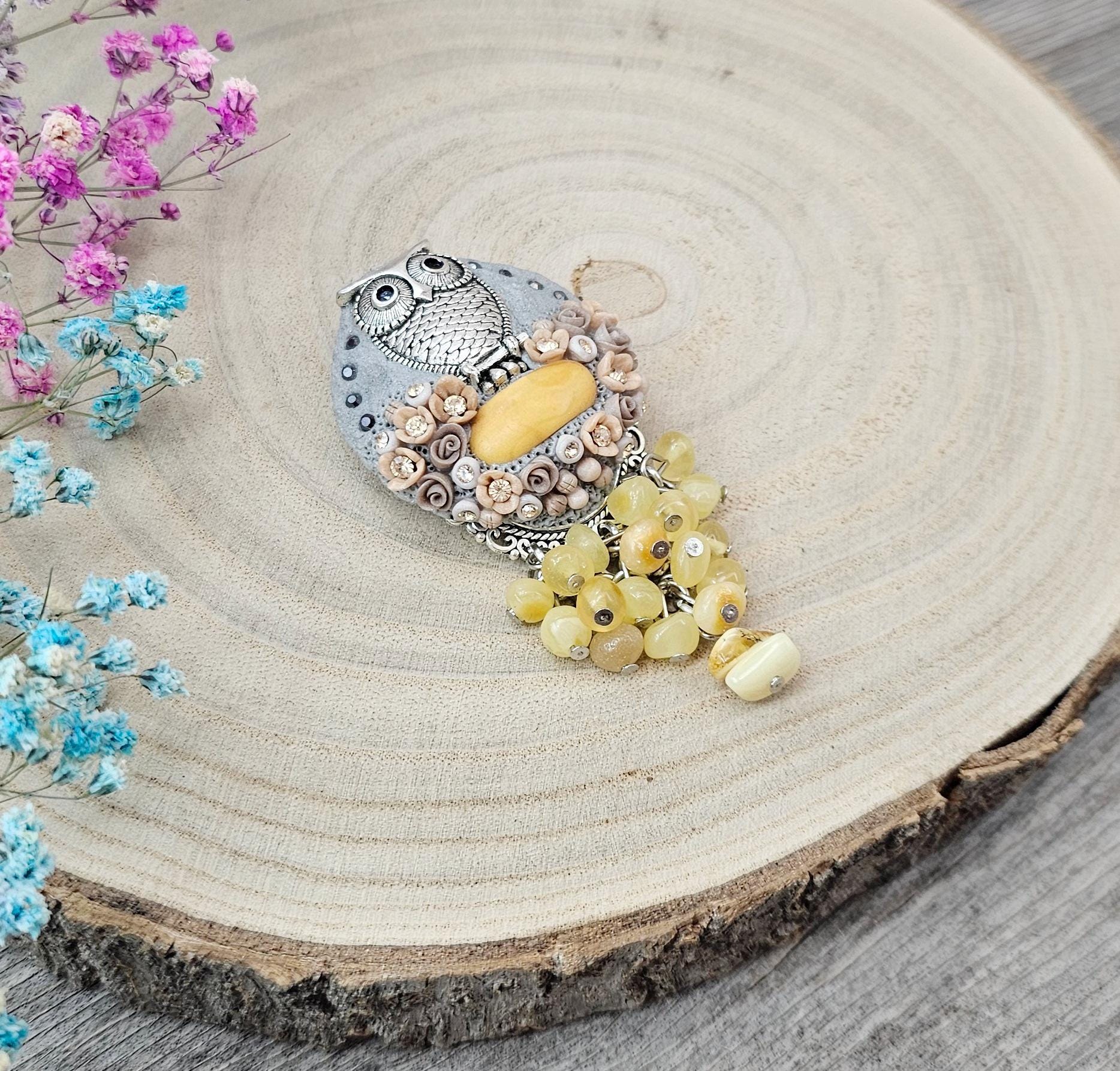 handmade polymer clay brooch with owl and handmade flowers and baltic amber