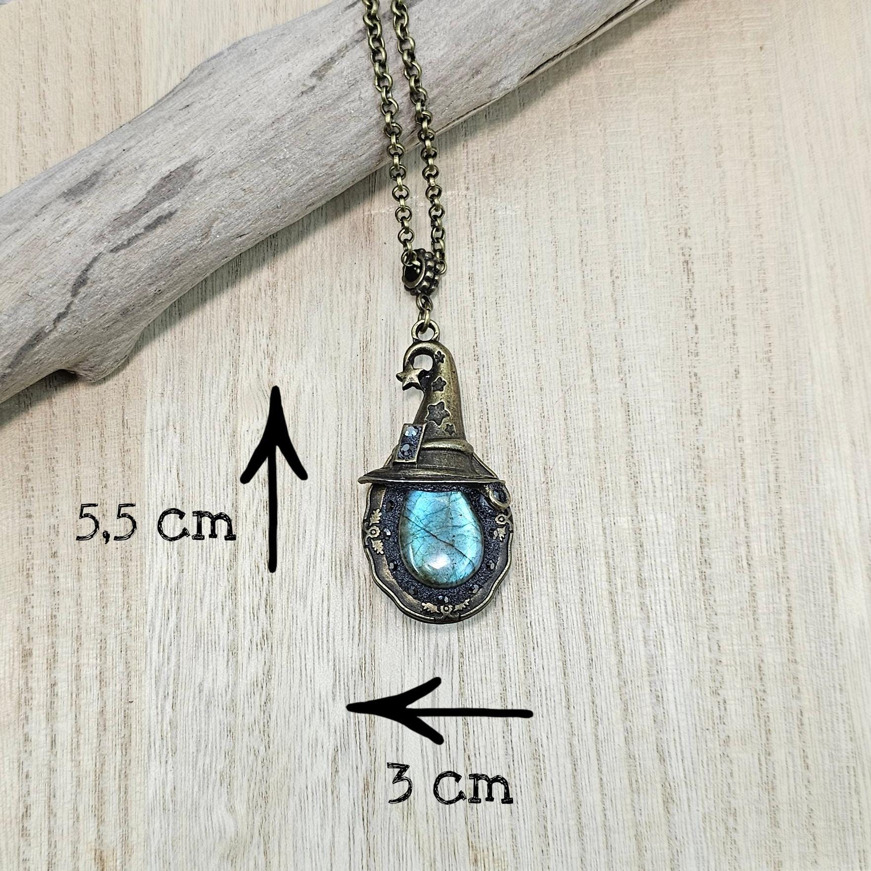 A magical pendant featuring a wizard’s hat, a stunning labradorite stone, and a hidden locket on the other side. Say “Abracadabra” and let your wishes come true!