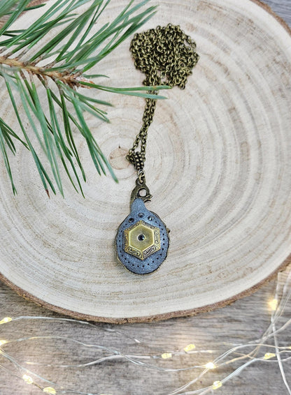 A magical pendant featuring a wizard’s hat, a stunning labradorite stone, and a hidden locket on the other side. Say “Abracadabra” and let your wishes come true!