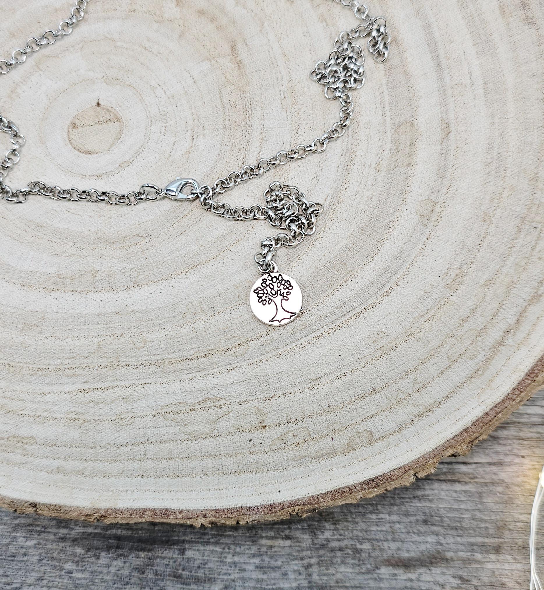 The shimmering labradorite stone, known for its protective and mystical properties, is beautifully framed in polymer clay and set in a silver-tone locket design.