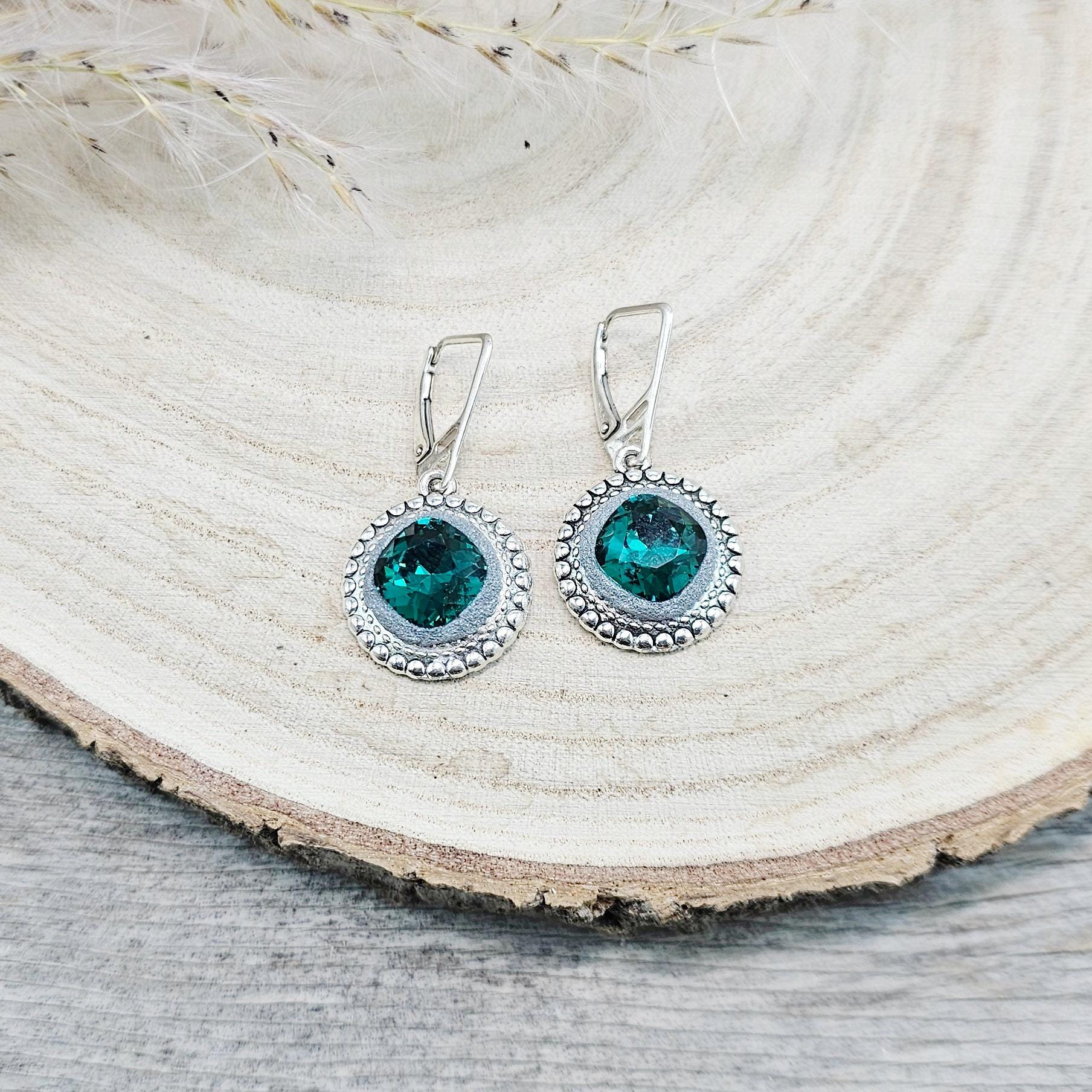 Elegant dangle earrings with sparkling emerald color crystals set in metal frames with polymer clay details. Silver hooks. Packaged in a paper gift box. A perfect accessory for any occasion, adding a touch of brilliance and sophistication
