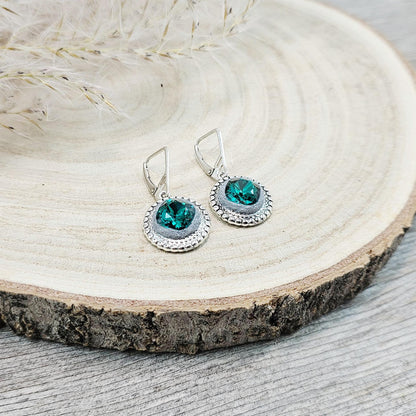Elegant dangle earrings with sparkling emerald color crystals set in metal frames with polymer clay details. Silver hooks. Packaged in a paper gift box. A perfect accessory for any occasion, adding a touch of brilliance and sophistication