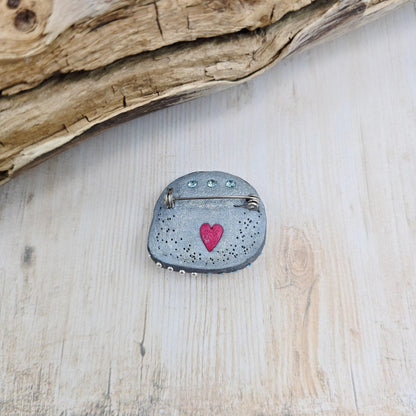 Handmade brooch with labradorite and bear design – polymer clay pin symbolizing strength and protection, unique nature-inspired jewelry.