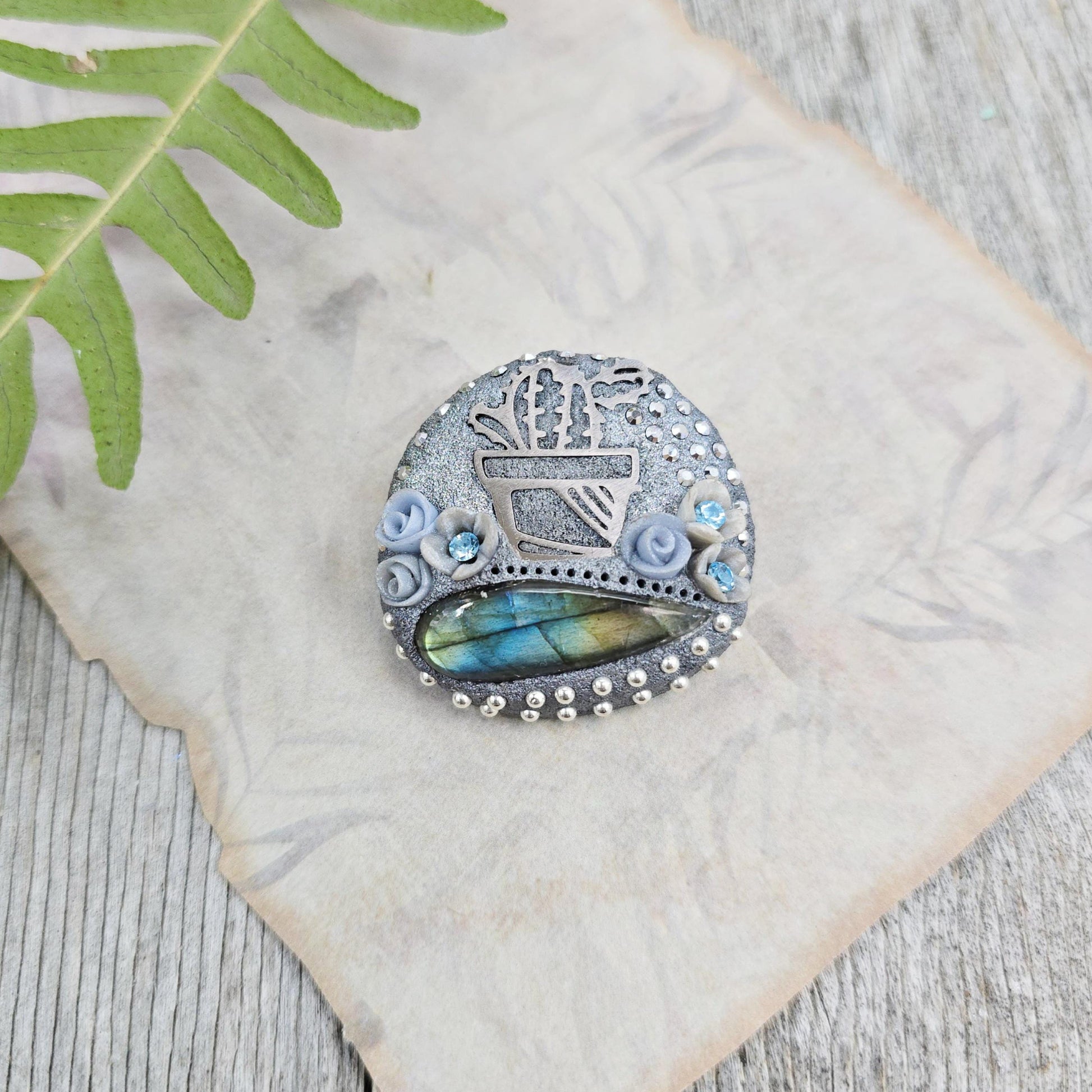 Handmade cactus brooch with shimmering labradorite, crafted from polymer clay and stainless steel – a unique mystical accessory inspired by nature.