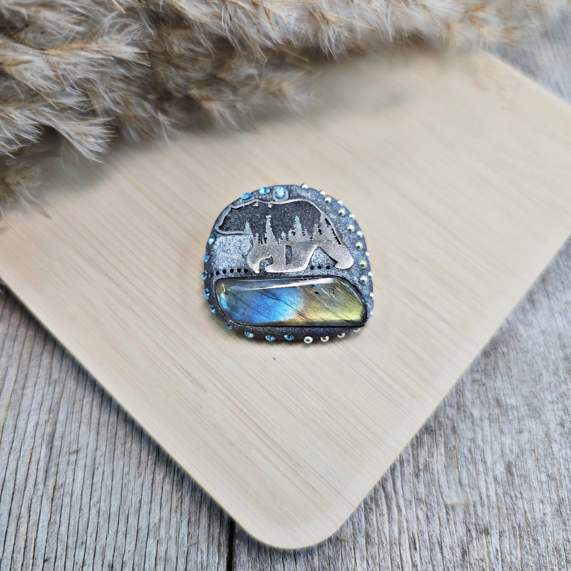 Handmade brooch with labradorite and bear design – polymer clay pin symbolizing strength and protection, unique nature-inspired jewelry.