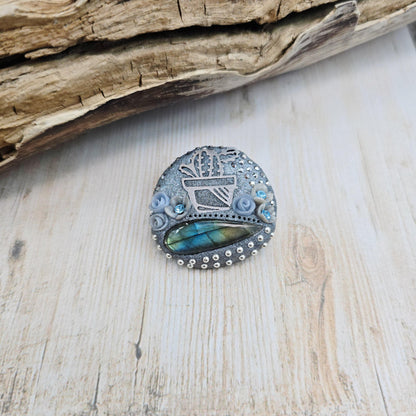 Handmade cactus brooch with shimmering labradorite, crafted from polymer clay and stainless steel – a unique mystical accessory inspired by nature.